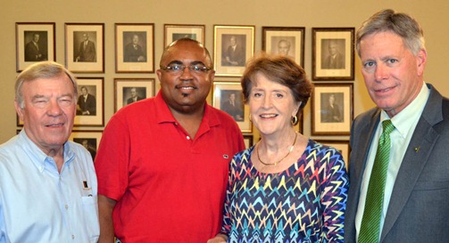 Pictured are Ned Mitchell, Peter Woods, Cheryl Lyon, and President William N. LaForge.